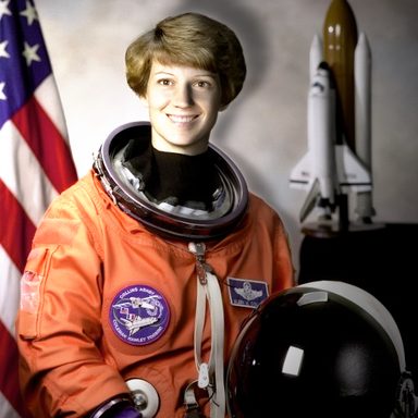 The astronaut photo relit from the left: the left of the face and suit is bright, the right side is in shadow
