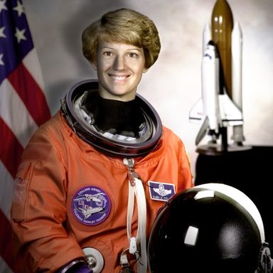 The astronaut photo relit from the right: the right of the face is bright and the left is in shadow